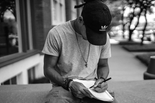 Man writing in a notebook